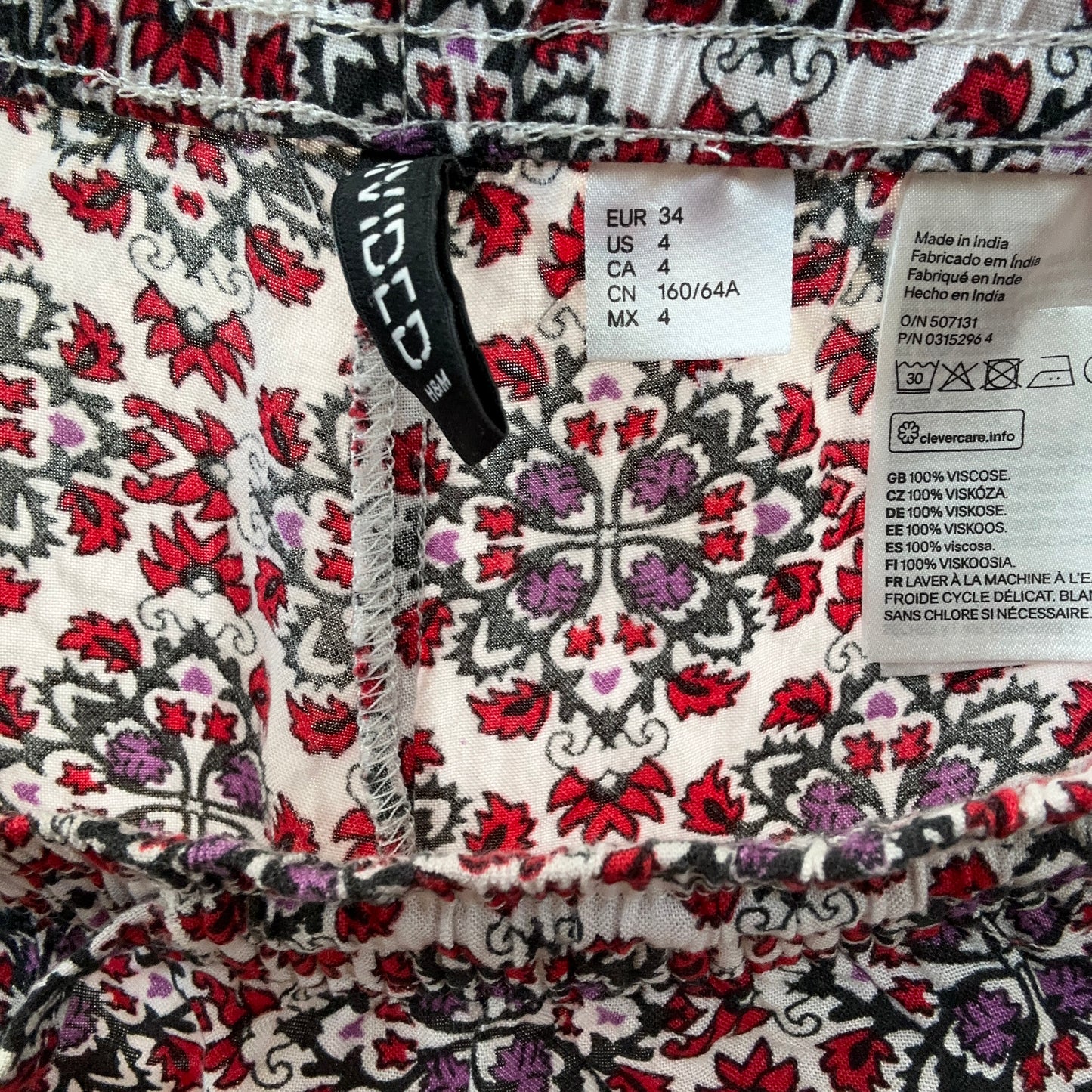 White pants with red, purple and black pattern | Bern