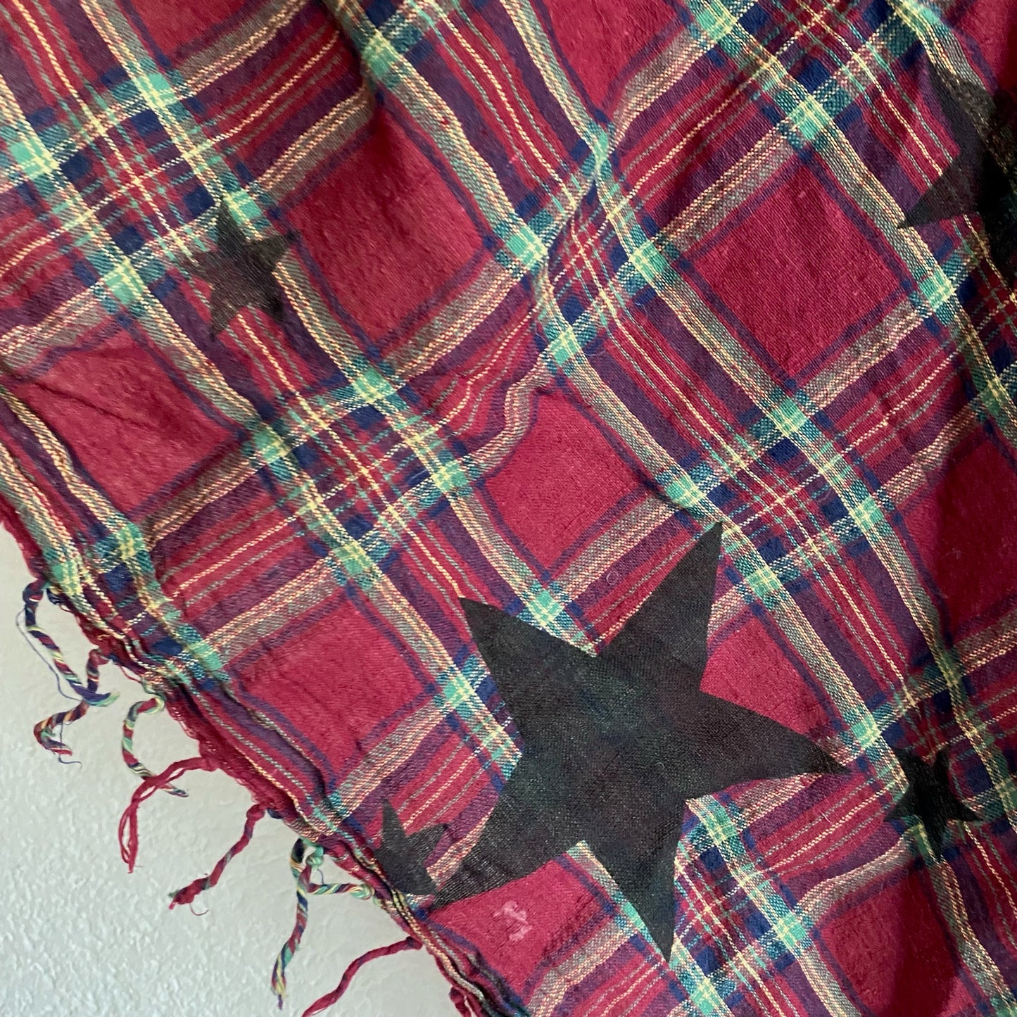 Red Scarf with green and white lines and black stars