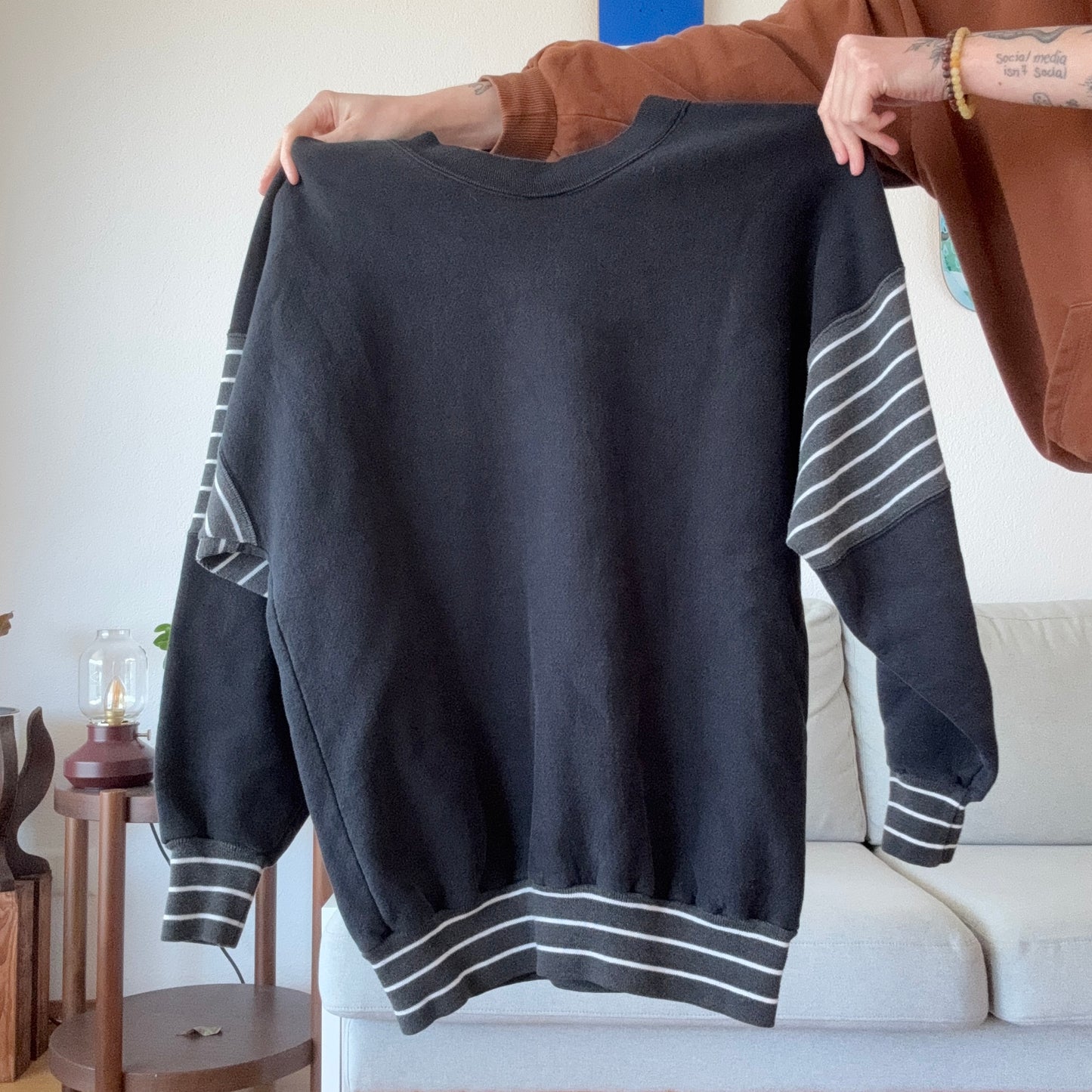 Black Sweater with striped sleeves and red Print | Bern