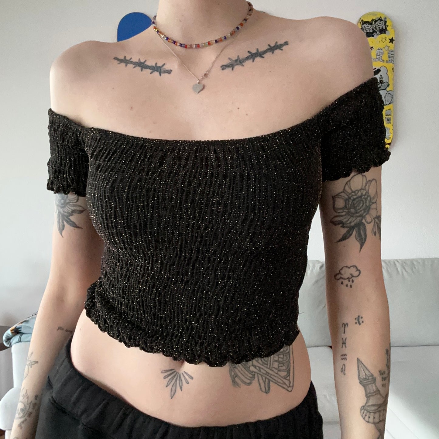 Black offshoulder cropped shirt with golden glitter