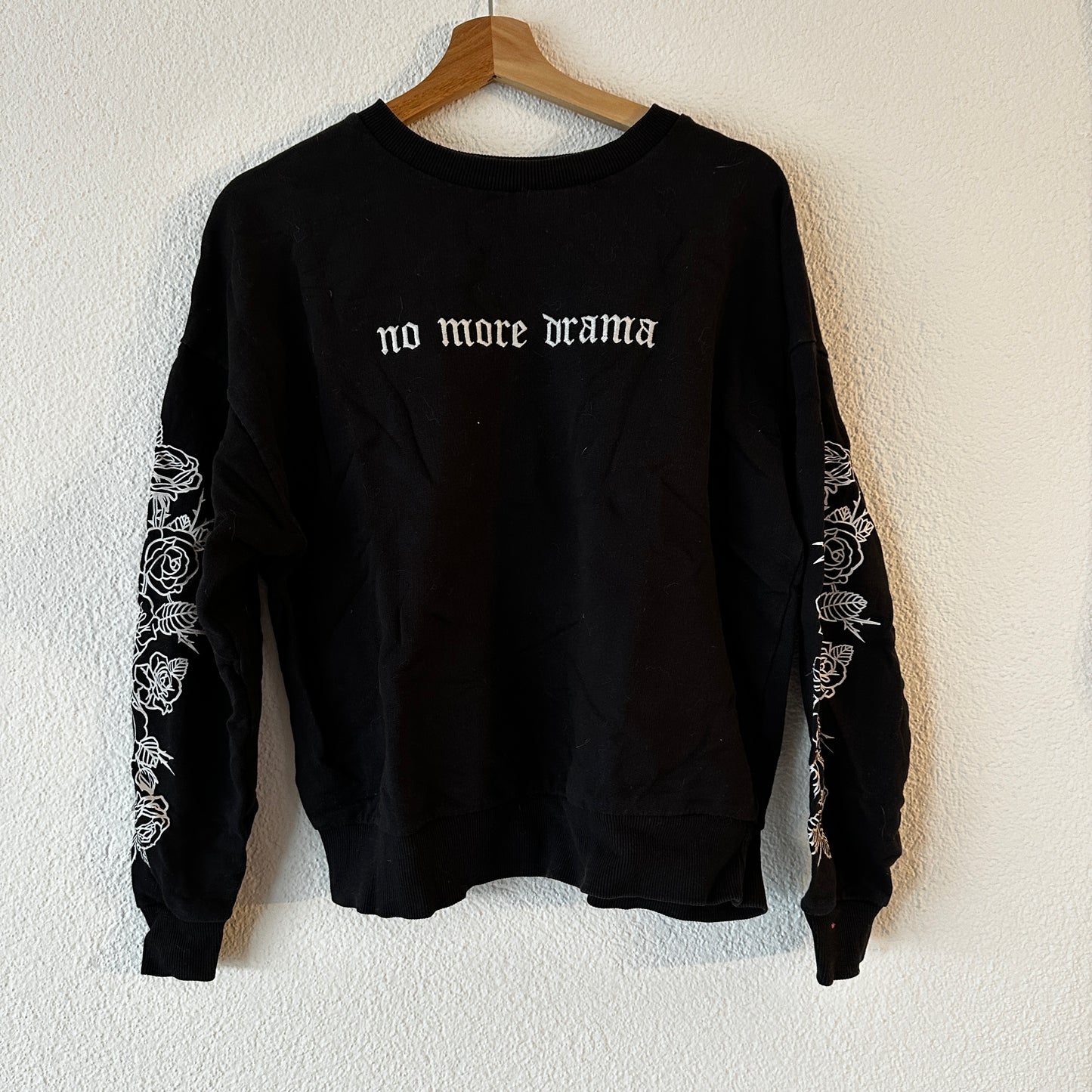 Black Sweater with cute White print in the front and on the sleeves