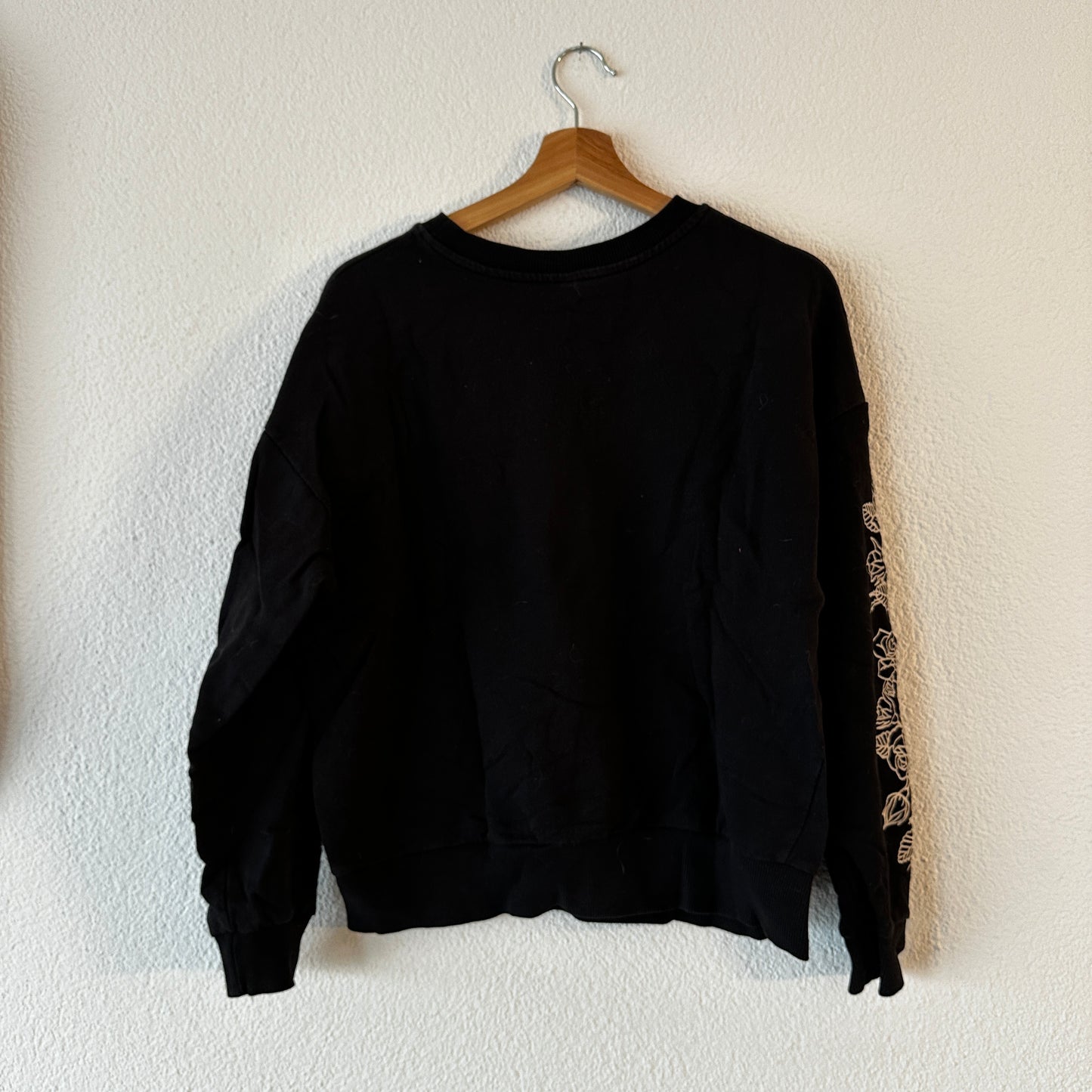 Black Sweater with cute White print in the front and on the sleeves