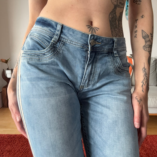 Blue Capri Jeans with white and gold stripes on the side