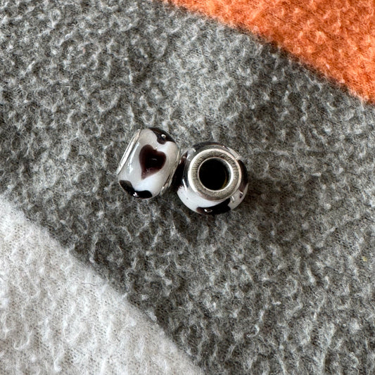 White Jewel with brown/black hearts on it